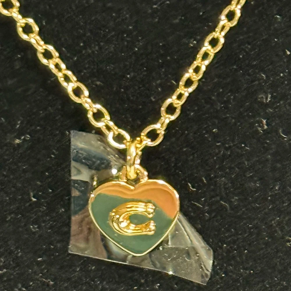 Coach fine gold